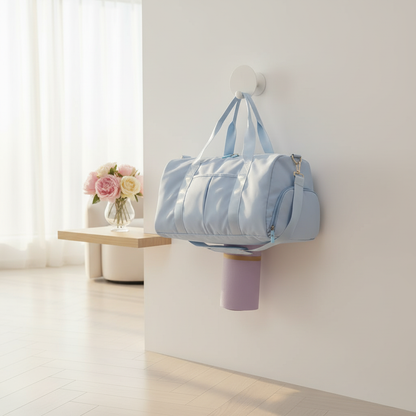 Blue women's gym and yoga bag hanging in minimalist studio